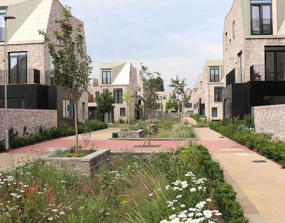 Existing walking routes along a disused railway line become an opportunity to connect new and existing neighbourhoods. New development responds positively and maximises the opportunity to improve surveillance and safety of the route. Derwenthorpe, York