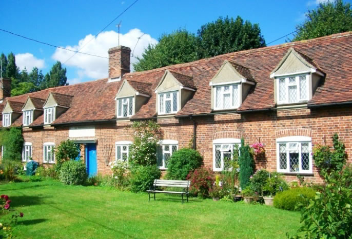 Dormers articulate the roof of 18th Century almshouses in Little Bardfield.