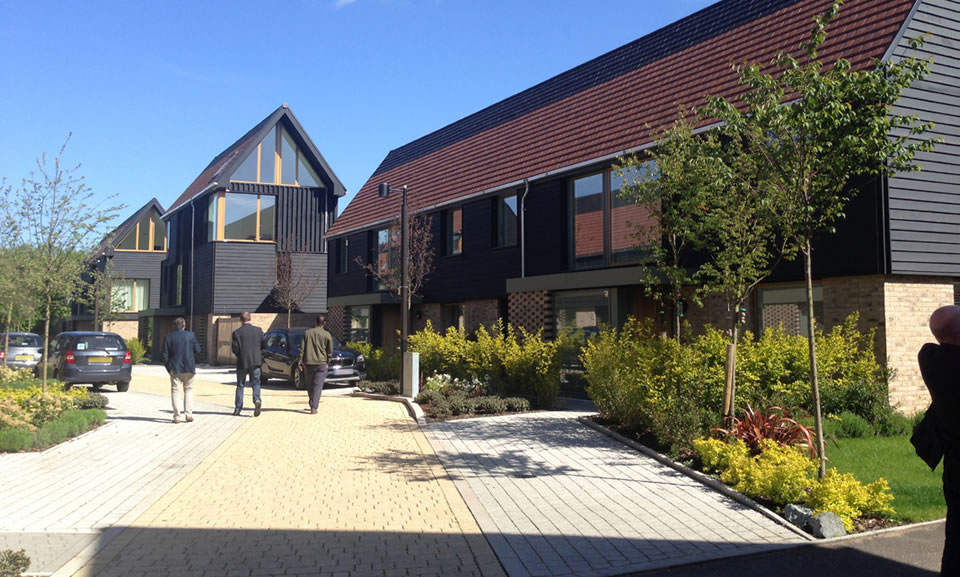 Lanes within higher density development use informal landscaping and clearly define parking bays.