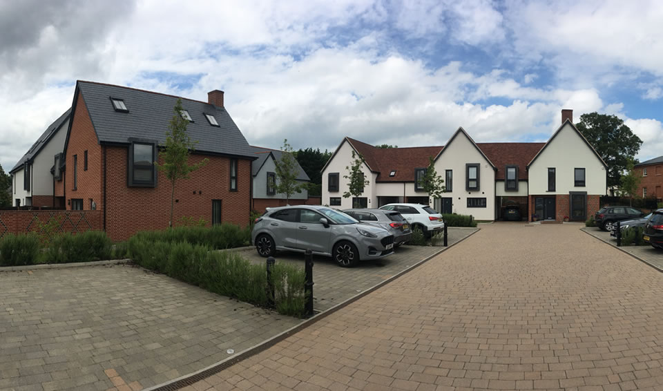 Homes are grouped around courtyard parking which is overlooked by varied forms and articulation.