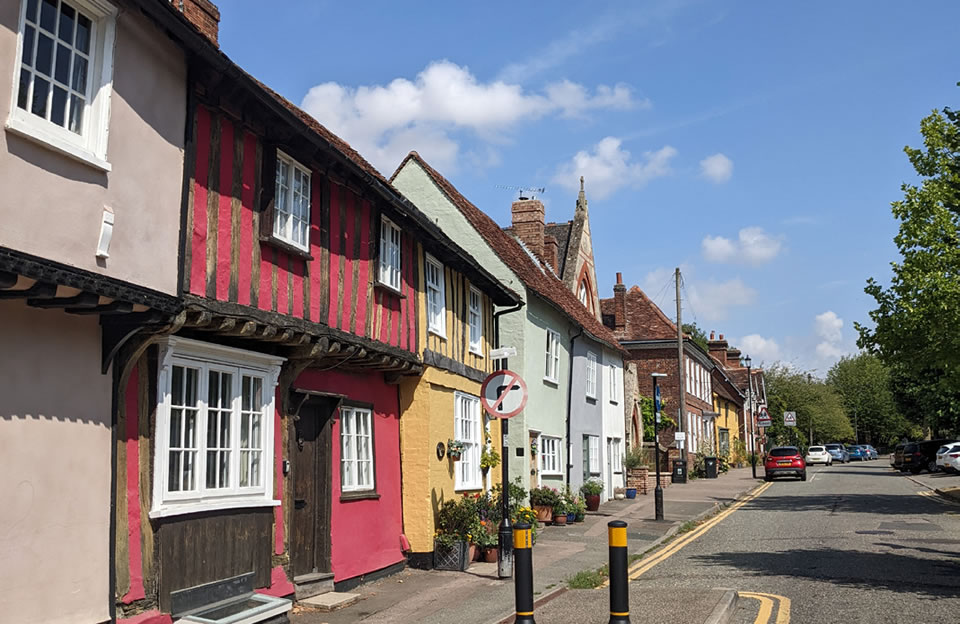 Timber framed terraces with varying rooflines leading out onto Castle Street.