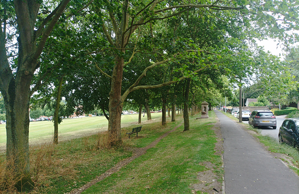 Grass verges and green space integration on B1052.