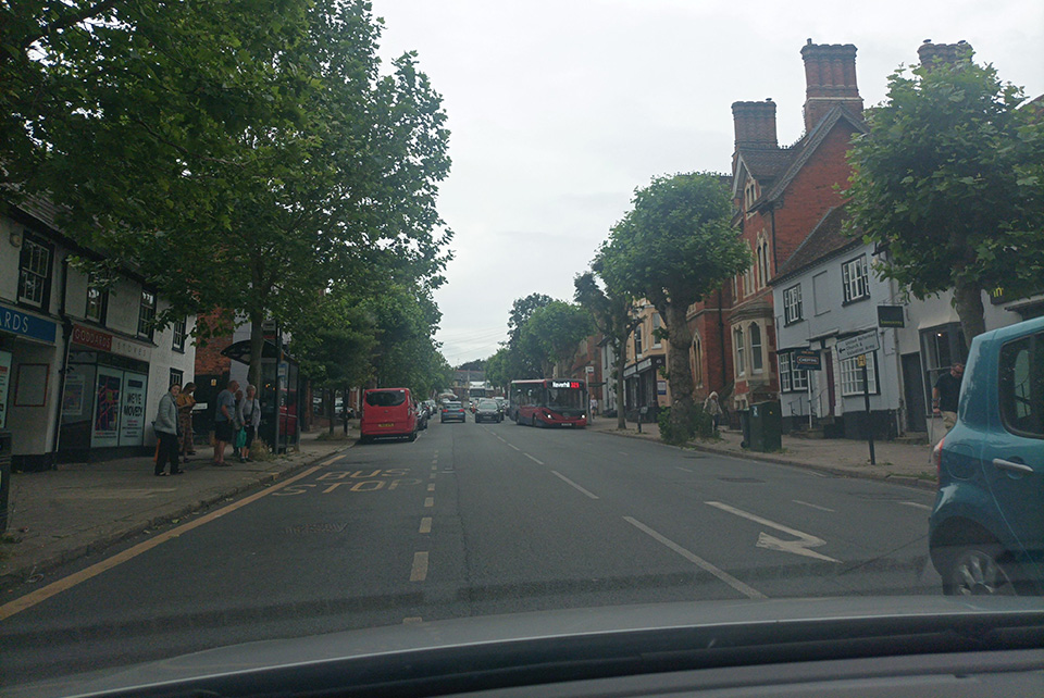 Street trees, strong building frontage, historic lighting and key landmark within view along the High Street.