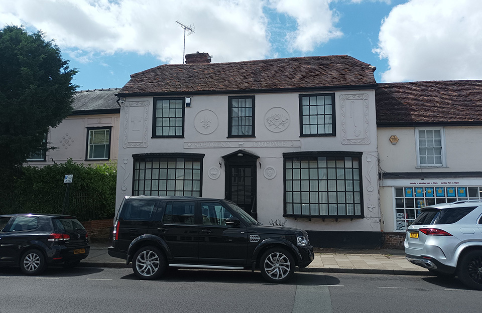 Former shop retains pargetting and bay windows to enhance ornate character of new terrace home - High Street, Great Dunmow.