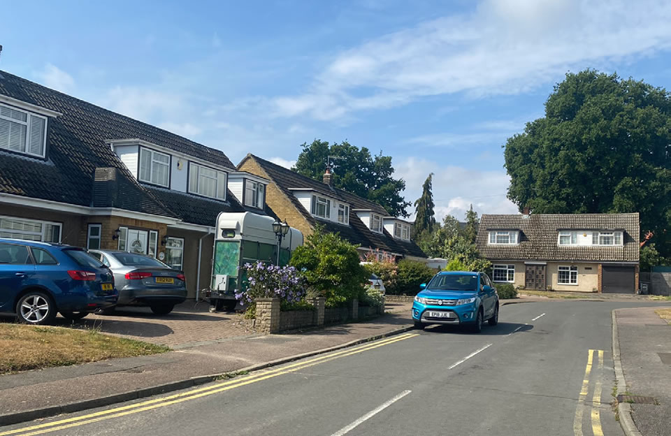 Almshouse influence on single storey homes with steep pitched roofs with dormer windows.