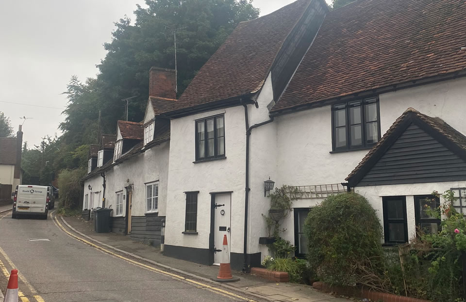 Consistent Timber framed terraces on Grove Hill with minor differences creating a coherent sense of character without repetition.