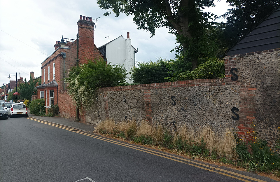 Sense of arrival entering East on Lower Street through varied roofscape and animated landscape features.