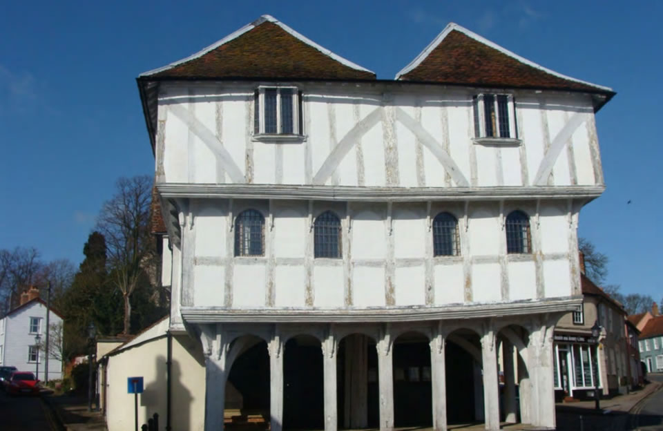 Grade I listed Guildhall in Thaxted, ground floor forms open flagged market house with open timber ceiling, and heavy cross beams.