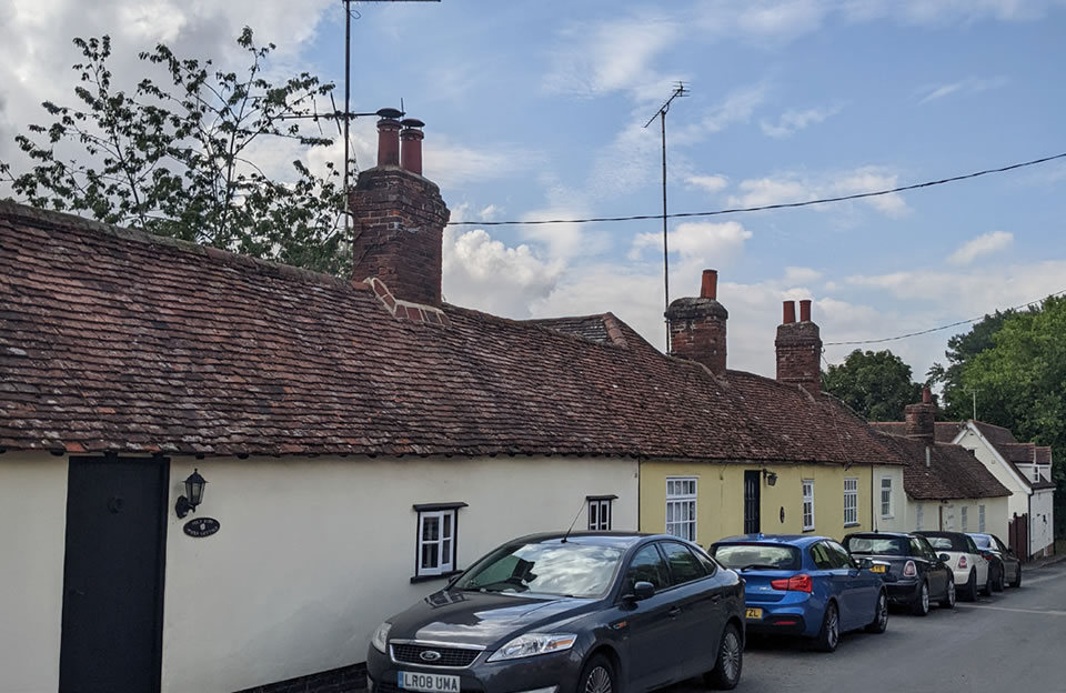 Single storey timber framed terrace houses decline in line with topography creating variation and interest to the street scene in Newport.