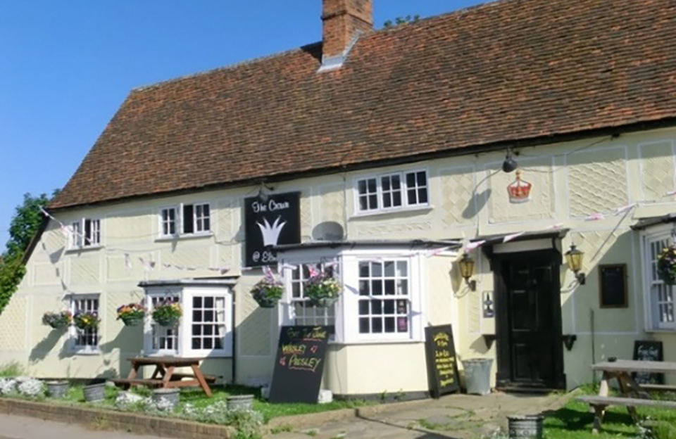 Along the high street in Elsenham is The Crown Inn (dating back to the 17th century), detailed with typical pargetting.