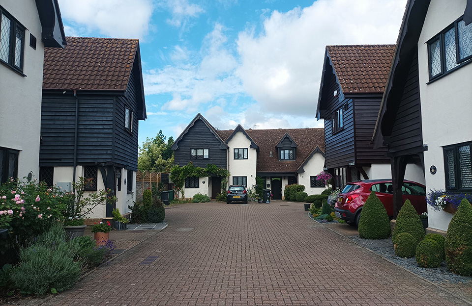 Shared space, with strong vernacular street character in Beehive Court, Hatfield Heath.