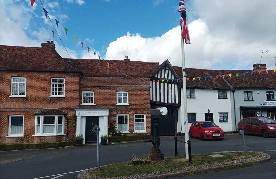 Red-brick terraces, front facing timber framed gables, and pargetted dwellings create variety yet coherence in Hatfield Broad Oak.