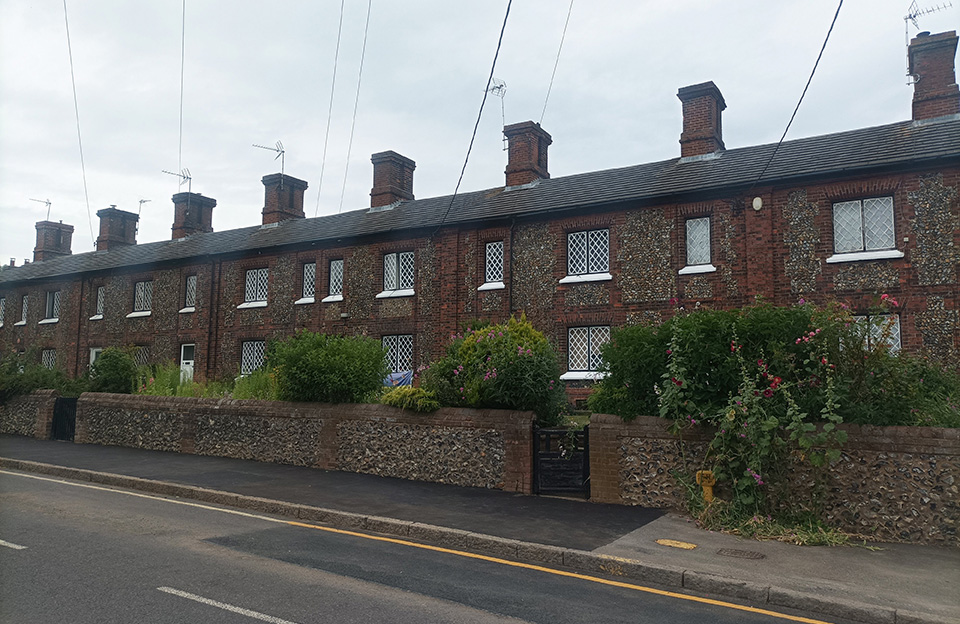 Mid 19th century terraces of flint-faced dwellings create distinctive village character in Wendens Ambo.