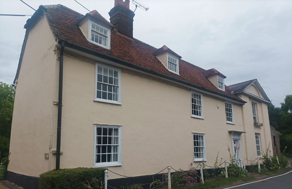 Peg tiled roof, sash, pilasters and dormer windows with soft boundary treatment at B1039, Wendens Ambo.