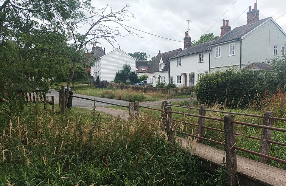 Footbridge leading to open space safely integrates users with both the landscape with the street scene, Clavering.