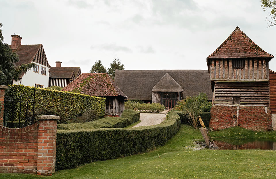 Colville Hall in Uttlesford with Thatched roofs, timber frames, and jettying.