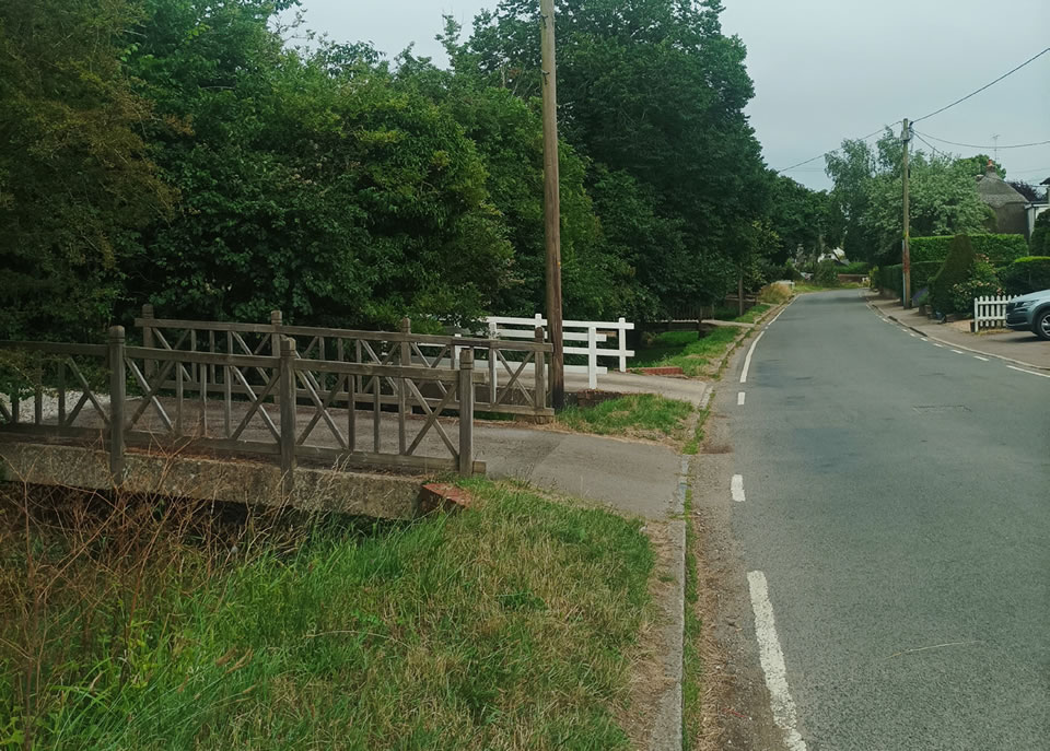 Swales and bridges form an attractive street scene within the green linear link in Arkesden.